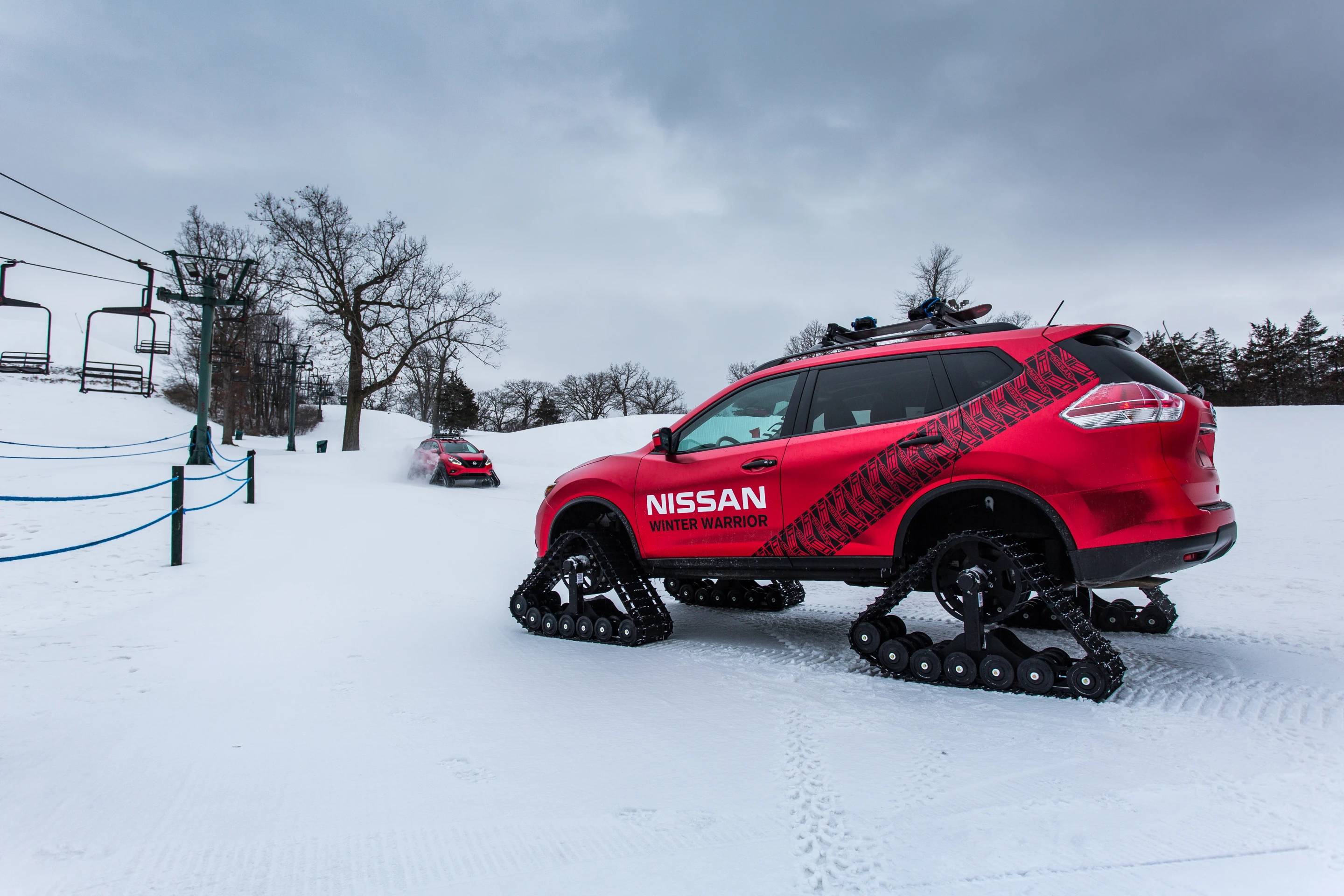 Nissan had to modify the wheel wells to fit the new tracks