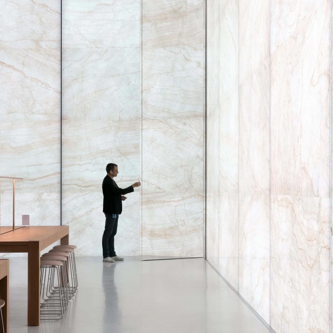 "The first-of-its-kind glass-stone composite facade comprises five layers of glass integrated with incredibly thin layers of stone, which gives the building its distinctive materiality – appearing as translucent stone walls, akin to stained-glass," says Foster + Partners
