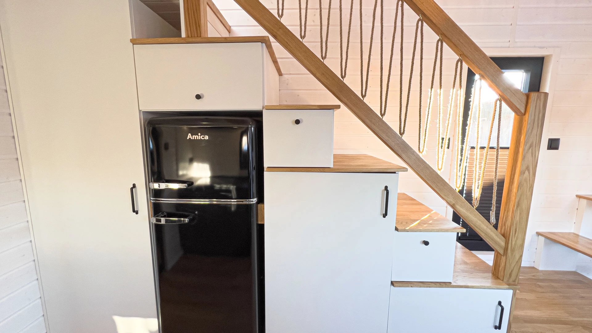 The Mobi Individual Baobab's fridge/freezer is integrated into the home's staircase