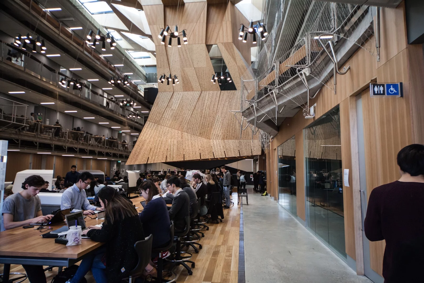 Up one level is where the studios and teaching spaces begin, but rather than lonely corridors and closed stairwells, the floor opens up to a mammoth four-story atrium bathed in natural light
