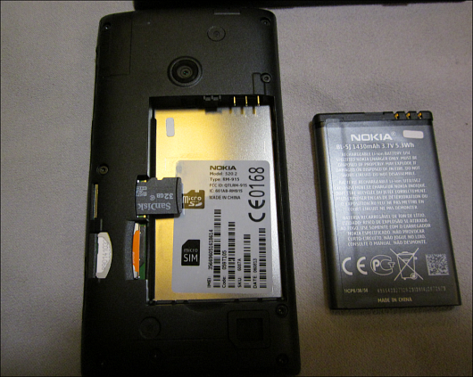 To install a microSD card you'll need to pop open the back, remove the battery, and insert it the appropriate slot