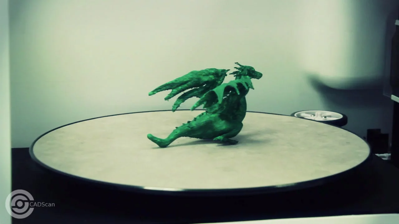 Objects are rotated on a tray as two scanning heads image the object from above and the size in 360 degrees