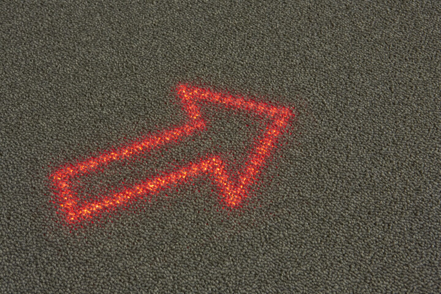 Philips and Desso have only mentioned that it will involve a layer of LEDs beneath a special light transmissive carpet, giving it the appearance of an ordinary carpet until it's lit