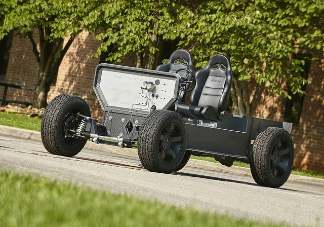 The 3D-printed vehicle features an electric hybrid power-train, which uses natural gas to extend its range