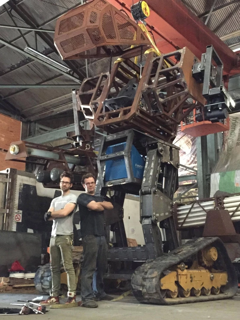 The 15-foot tall Megabot, with co-creators Gui Cavalcanti and Matt Oehrlein
