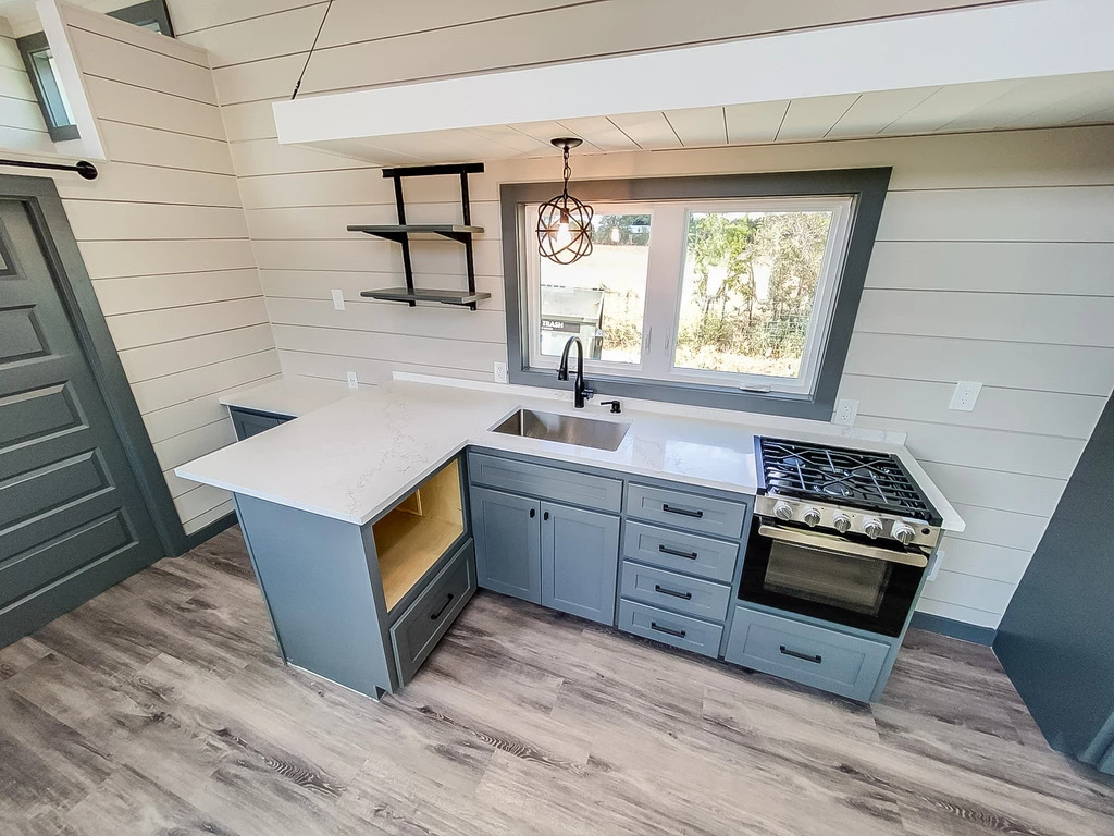 The Camden's kitchen includes a propane-powered oven and cooktop