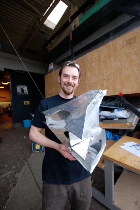 Artist Charlie Brinson with the first Titanoboa vertebra