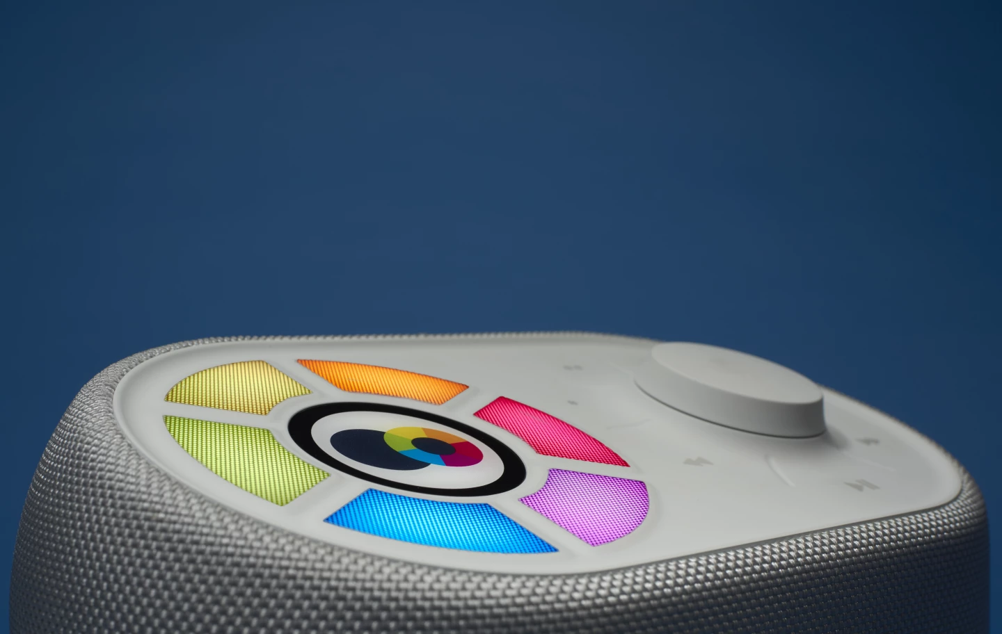 The Ellodee Sound Companion has a Wheel interface on the top, with six colored buttons that can be linked to specific pieces of audio content