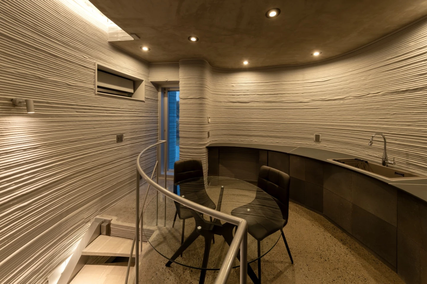 The O House includes a combined kitchen, dining, and living area upstairs