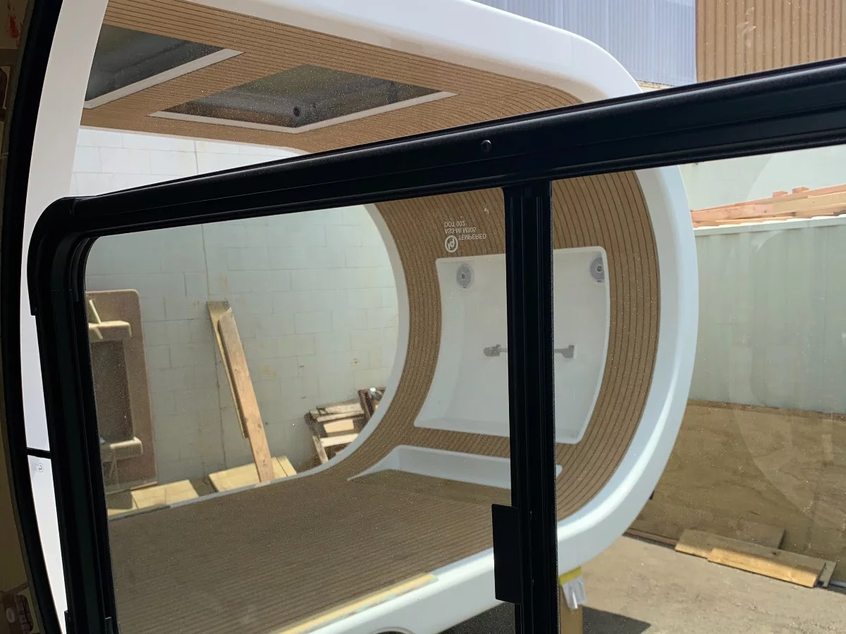 Looking out the window of the out-swung cabin