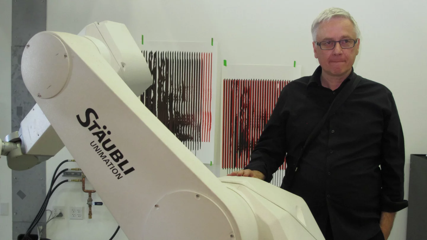 Studio professor Peter Testa with one of the Staübli "Unimation" robot arms (Photo: Phyllis Richardson)