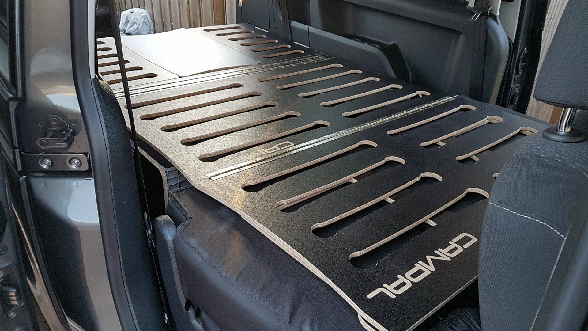 Campal hardware atop the folded rear seat