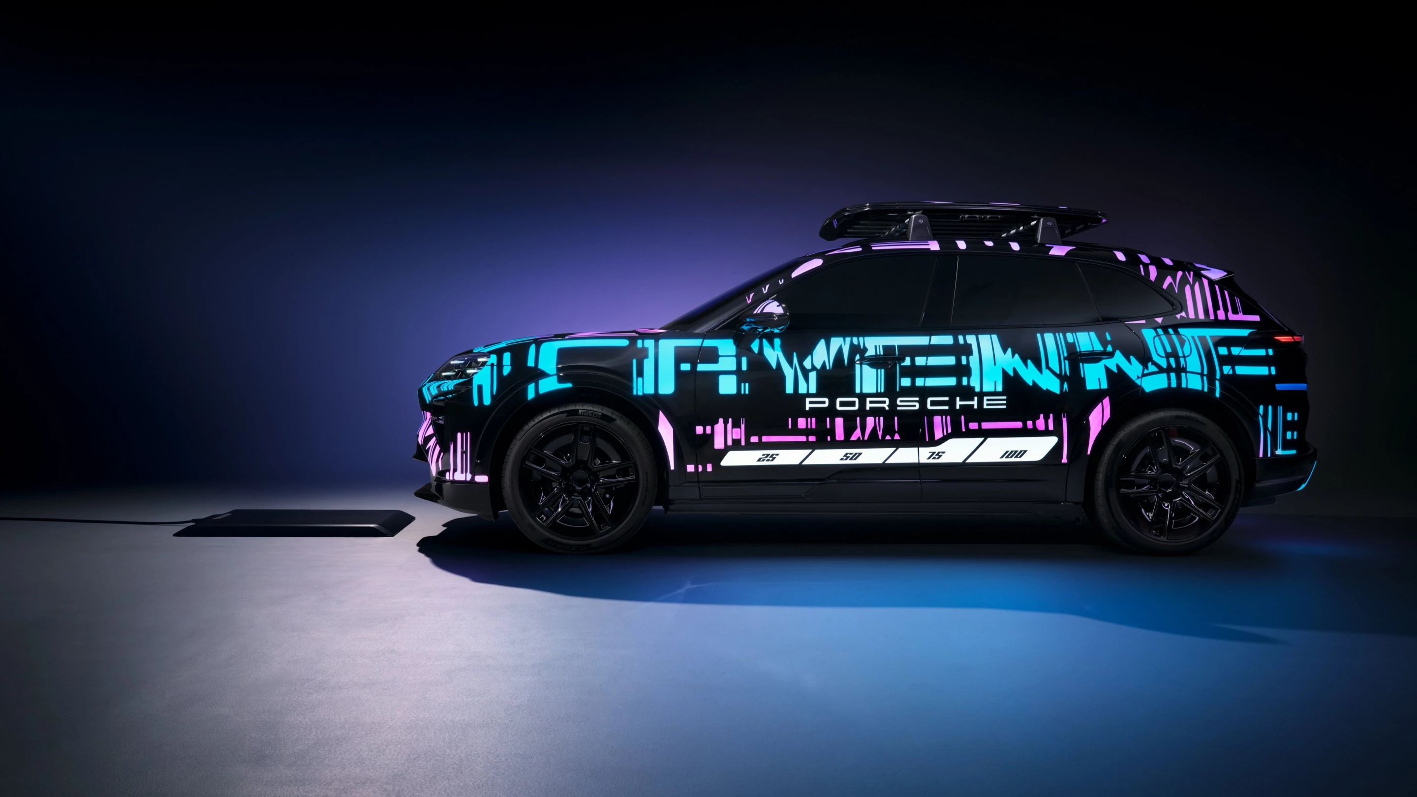 Using a prototype Cayenne Electric painted in bright fluorescent colors, Porsche demonstrates its new induction charging system