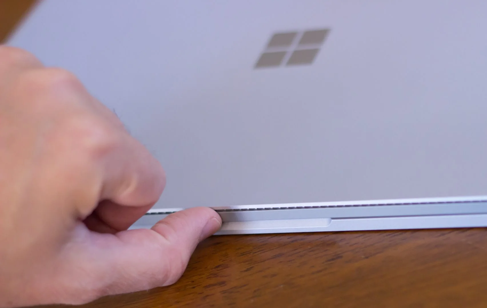 Unlike MacBooks, you can't easily open the Surface Book by lifting one finger here