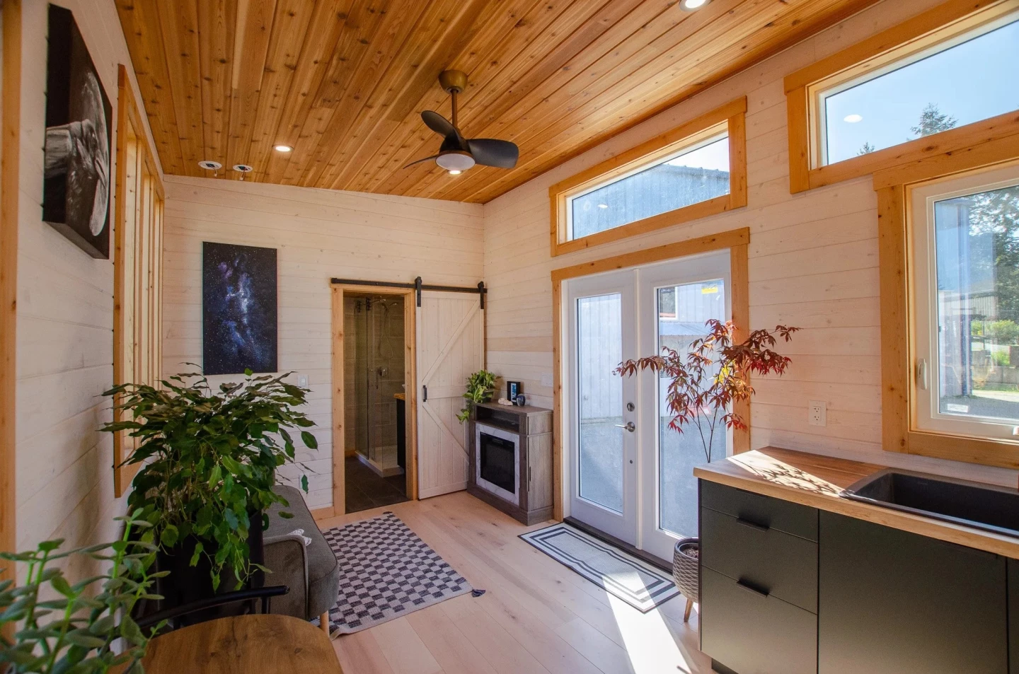 The Thicket's double glass doors really help open up the home to the outside, though they do mean less wall space for shelving or mounting a TV, for example