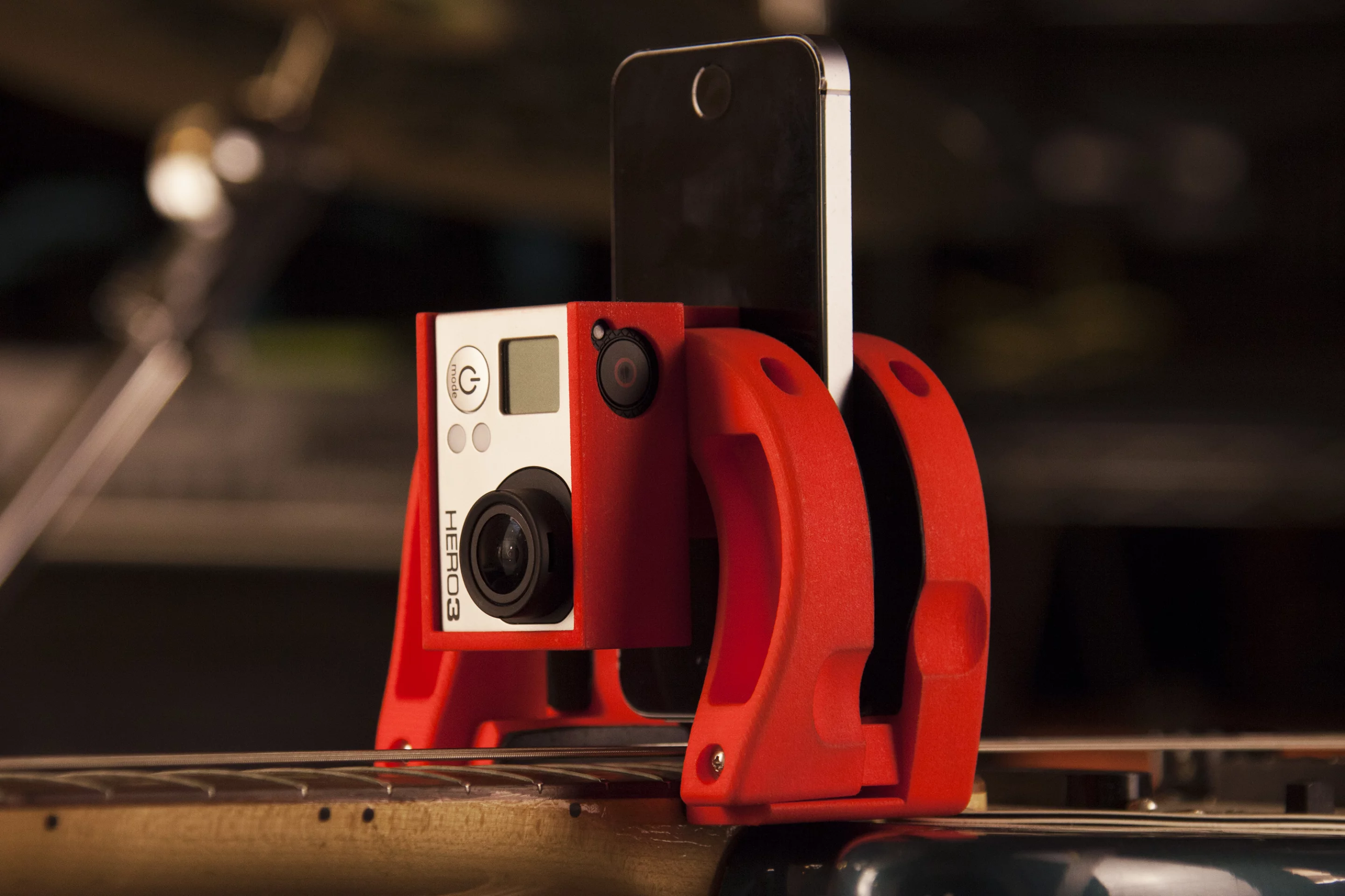 The smartphone camera lens can be directed at the picking hand or up the neck, or both ways using the optional GoPro mount