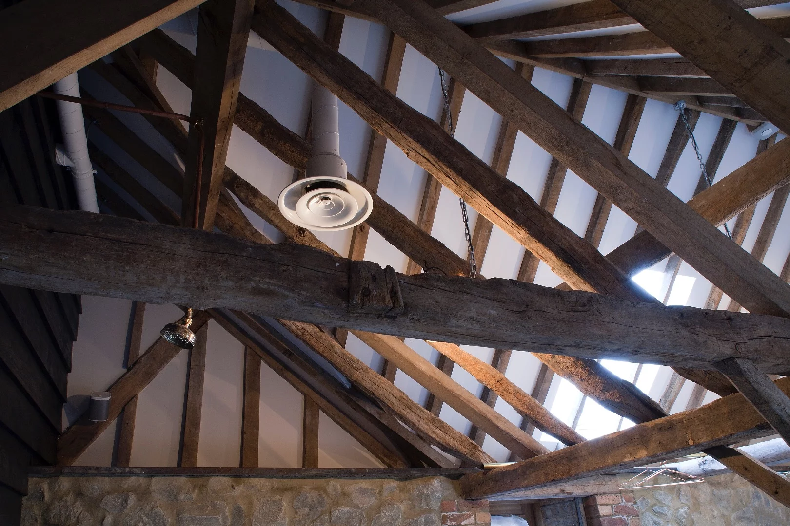 While it looks untouched, the main barn's oak frame and cladding is actually supported by a hidden steel exoskeleton