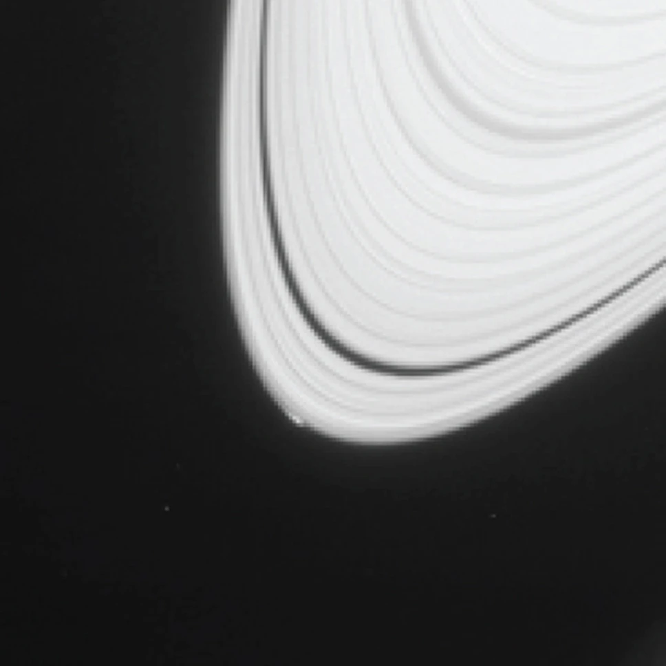 Image of the telltale arc that led scientists to hypothesize the existence of the new moon (Photo: NASA/JPL-Caltech/Space Science Institute)