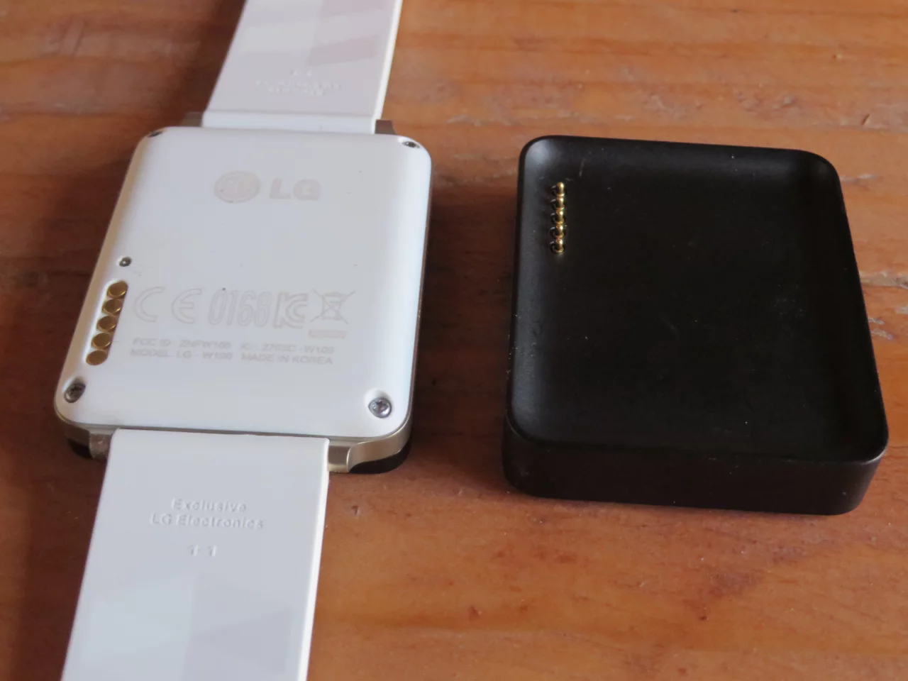 The G Watch from the back with charging station