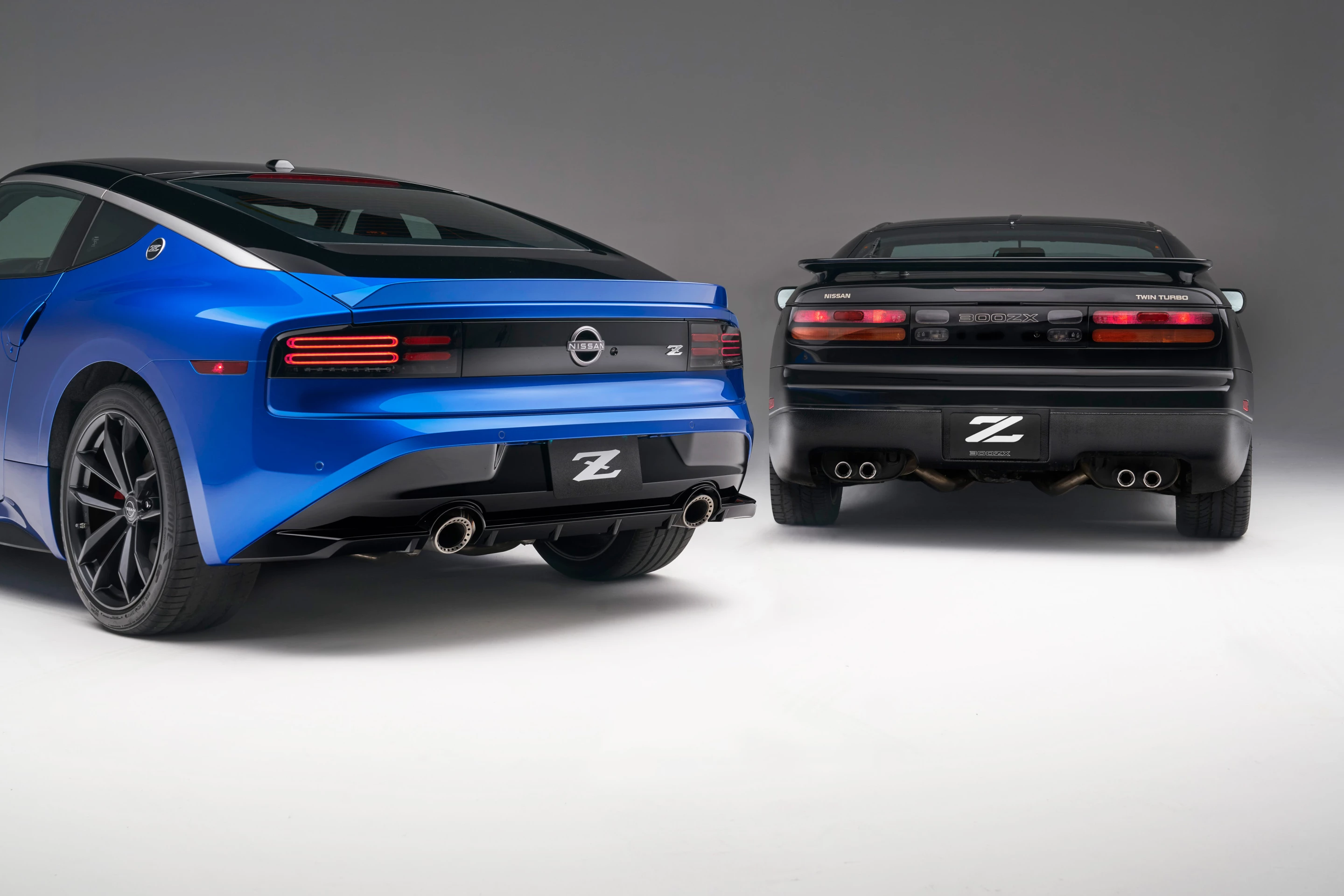 Clear impressions from the past are shown here as the new Z (blue) shows its design inspiration in the 300ZX to the right