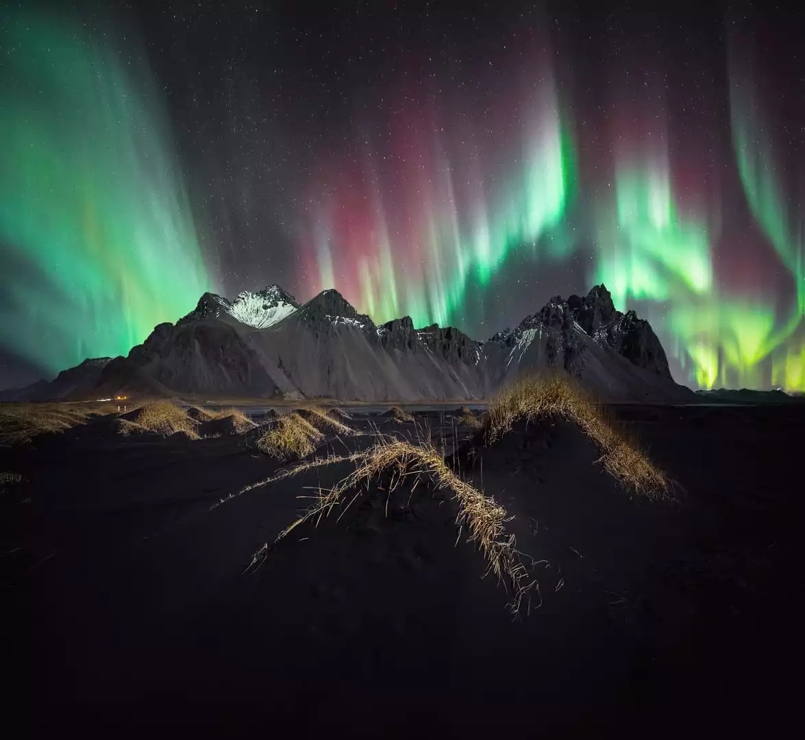 Spectrum by Stefan Liebermann, taken in Vestrahorn, Iceland. A strong geomagnetic storm produced a flurry of vivid colors, cut by a series of jagged mountaintops.
