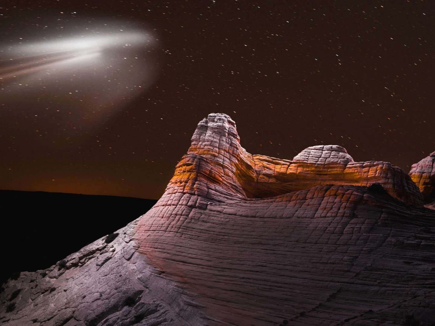 The trail in the sky in this image is from SpaceX's Falcon Heavy test launch