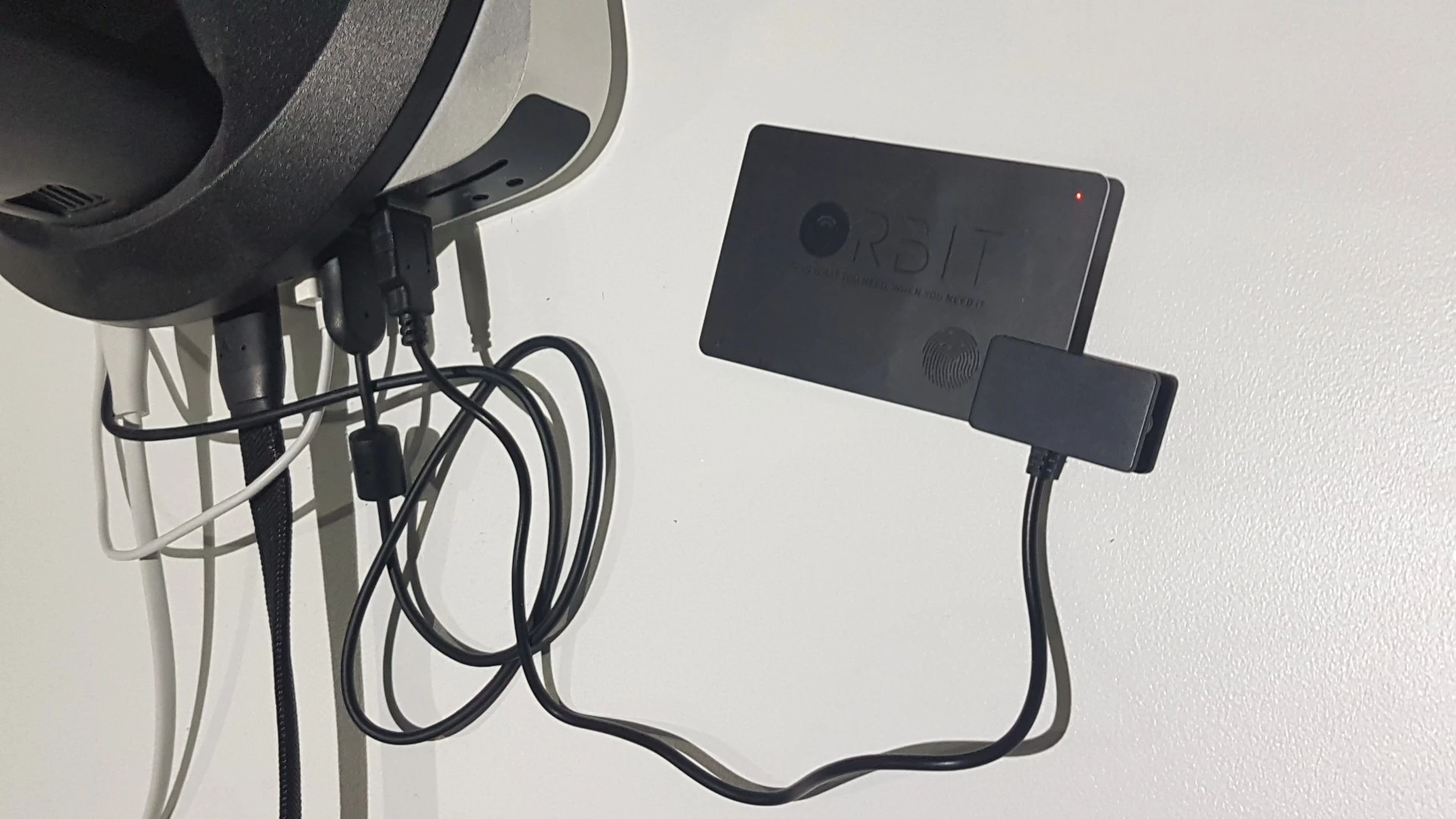 The Orbit Card's internal battery can be charged via USB, thanks to a clamp-like attachment