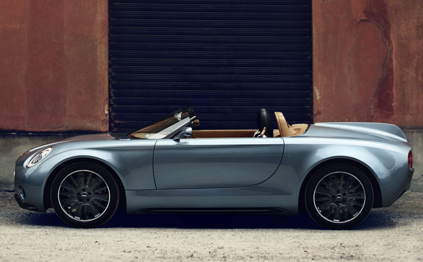 By using hand formed aluminum sheets Carrozzeria has produced a wonderfully sculpted, shortish roadster that evokes a number of design influences and eras