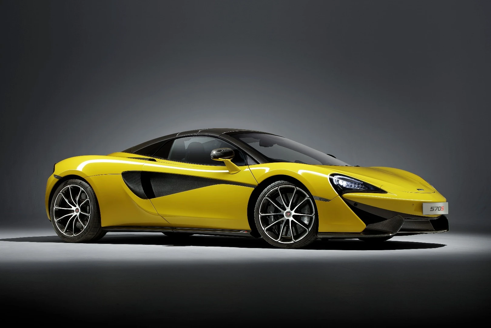 The folding hardtop mechanism on the McLaren 570S weighs just over 100 lb