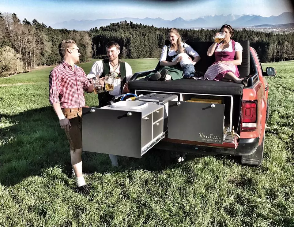 One side contains the full kitchen area, and the other has a general storage tray