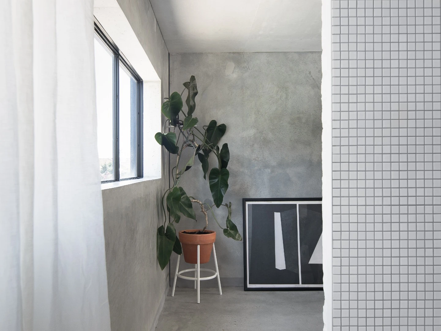Concrete walls are kept bare inthe upstairs quarters
