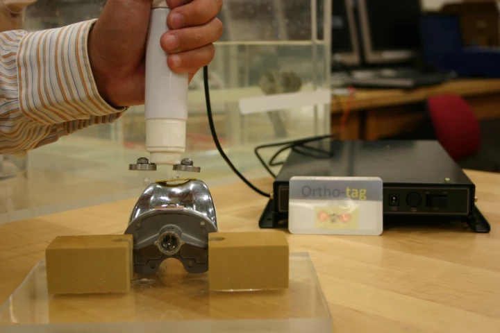 Ortho-Tag is a system in which information regarding orthopedic implants is stored on a chip attached to the implant, and can be read with a handheld external probe (Photo: University of Pittsburgh)