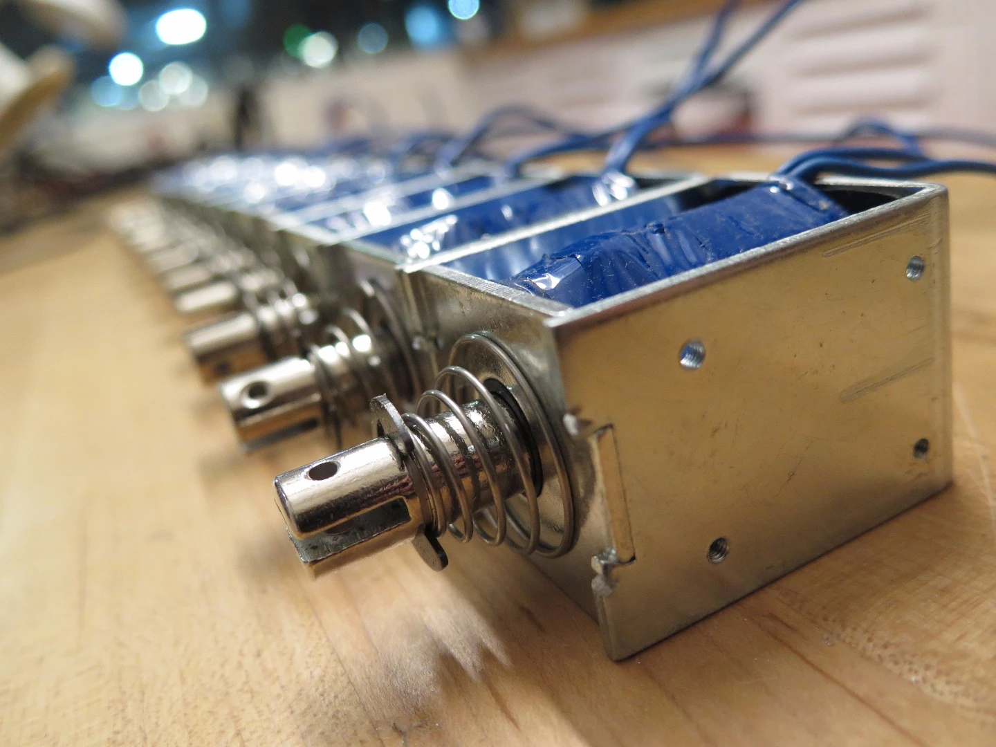 A bunch JF-1250B solenoids awaiting installation in the Pinger module of the Rock Band