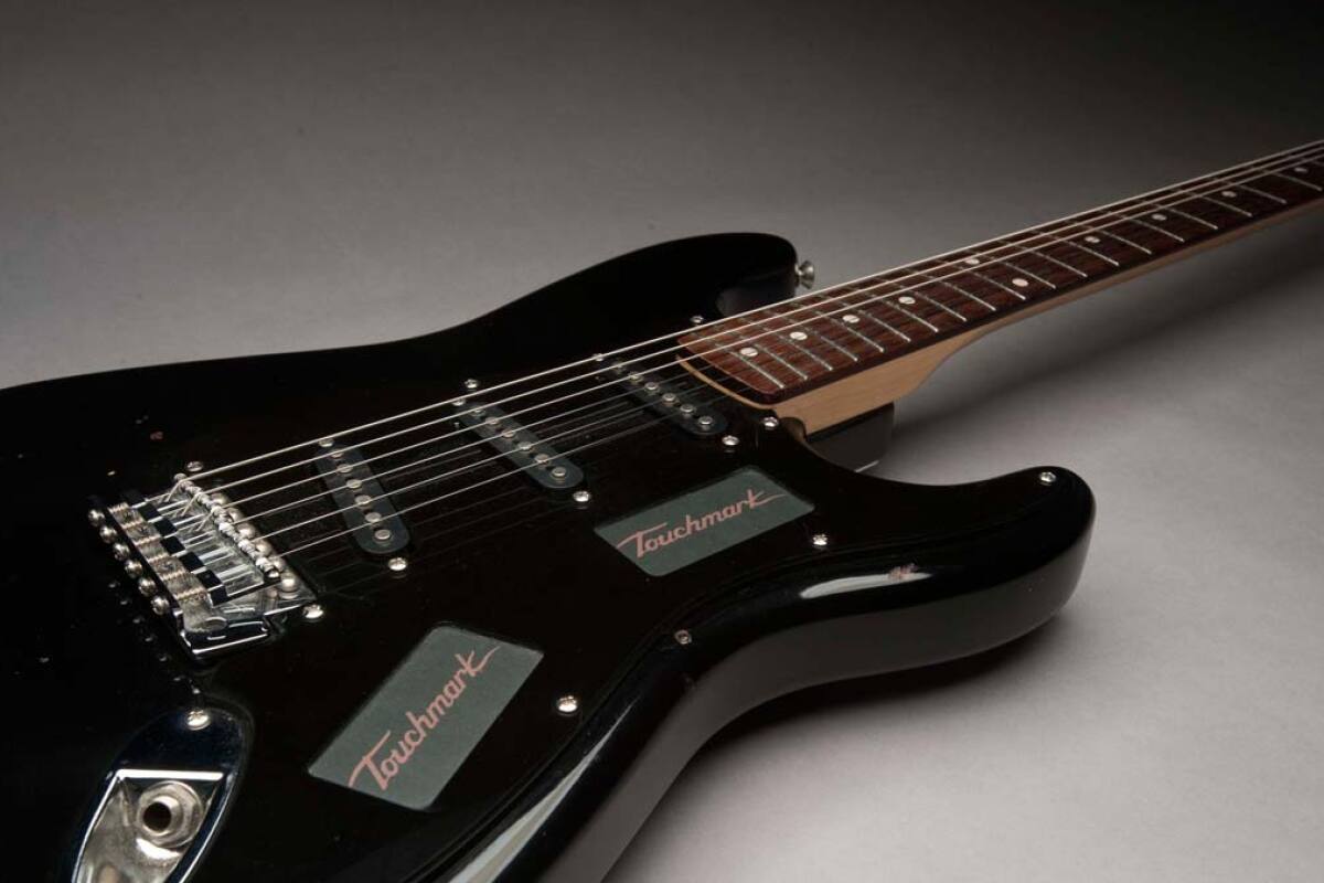 The Touchmark Interface System replaces the volume/tone knobs and pickup selector switch on an electric guitar with touch control panels