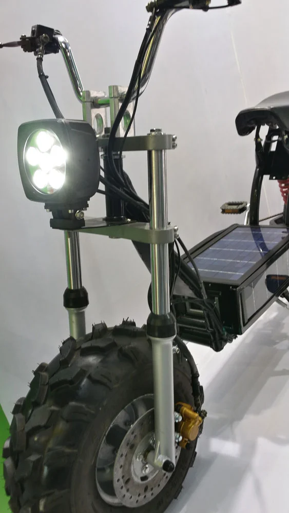 Inverted suspension forks hold the first of the 10-inch alloy rims and bear a 4,500 lumen LED headlight on the front