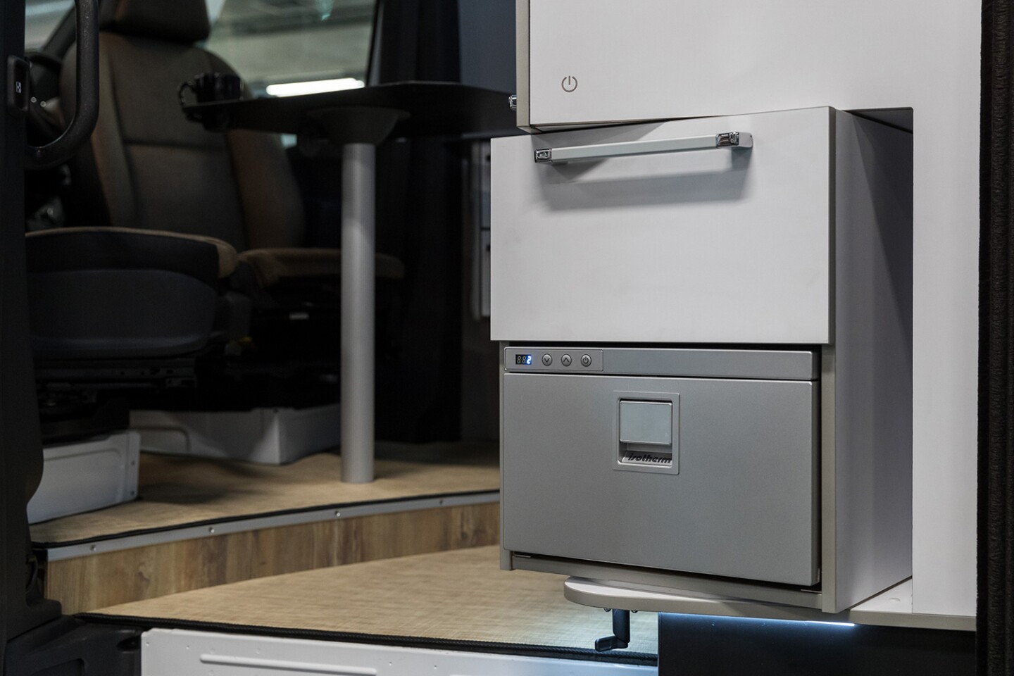 Swivel the fridge out and you can easily access drinks without climbing aboard