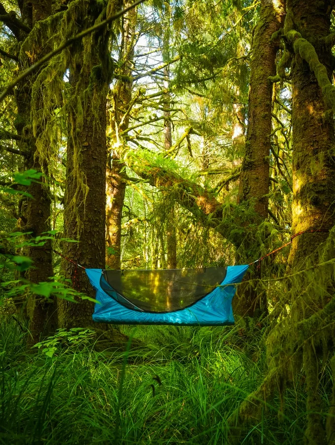 The Haven Tent can be suspended between two trees like a regular hammock, but offers occupants a flat sleeping platform thanks to an innovative design