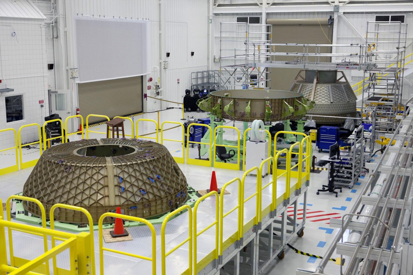Parts of the Boeing CST-100 Structural Test Article rest on test stands inside the Commercial Crew and Cargo Processing Facility, or C3PF, at NASA’s Kennedy Space Center in Florida