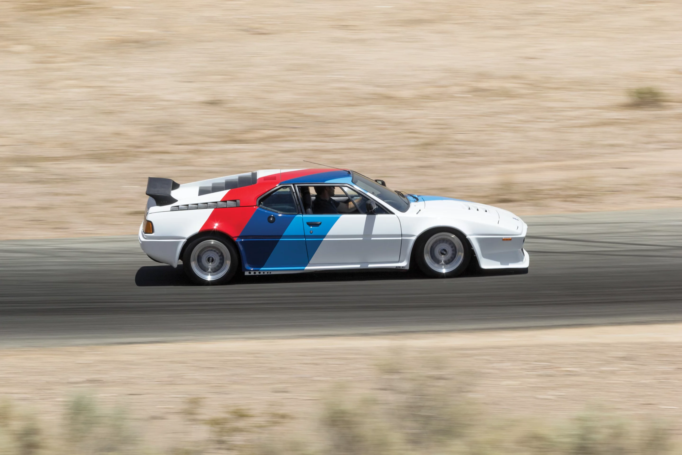 1980 BMW M1 AHG Studie. Auctioneer's Estimate: US$600,000 - US$800,000. The M1 was the most exotic BMW street car ever built. It was a limited-production, virtually hand-built car that was essentially a homologation special, and it featured a tube frame and utilized state-of-the-art technology underneath the radical Giugiaro-designed body. Just 456 examples were built. This car is one of only 10 examples created by AHG, has been uprated to 350 horsepower, and comes with M1 Procar-style bodywork and BMW Motorsport tri-color livery. It's original and unrestored, with less than 7,000 km on the odomoter. Official Auction Description and Images
