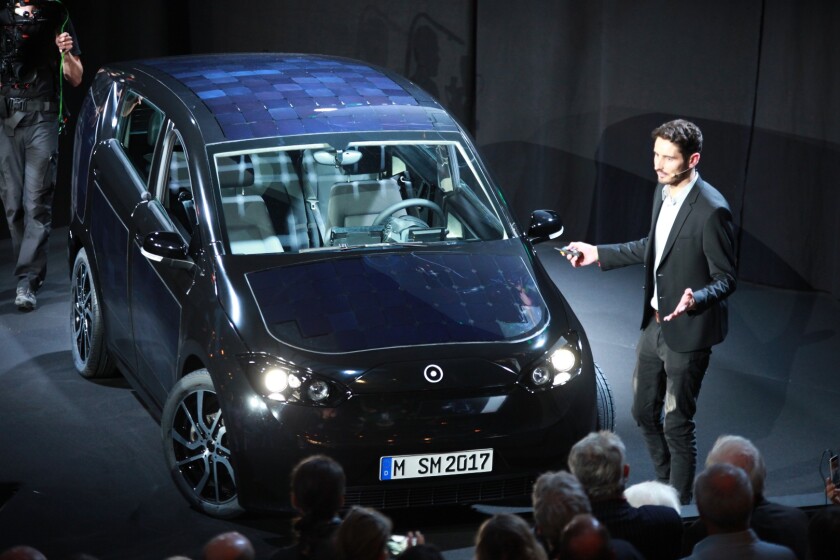 Laurin Hahn introduces the Sono Motors Sion electric car at a launch event on July 27