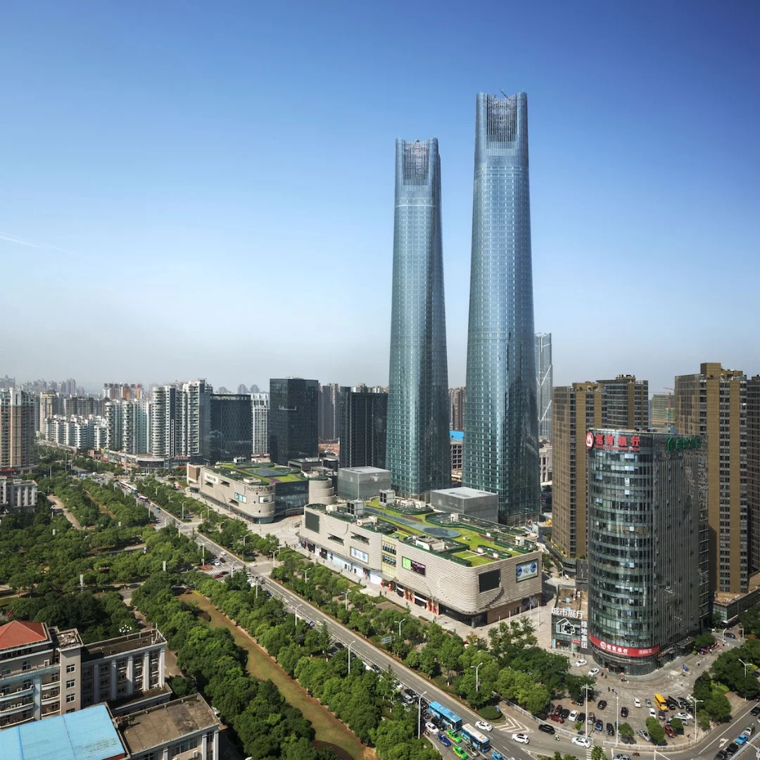 Comprising identical twin towers, Jiangxi Nanchang Greenland Central Plaza rises to 303 m (994 ft)