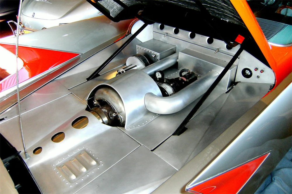 The current owner has installed a compact, 70 horsepower (52 kW) single-stage AiResearch turbine into the space the lowly four-pot once sat