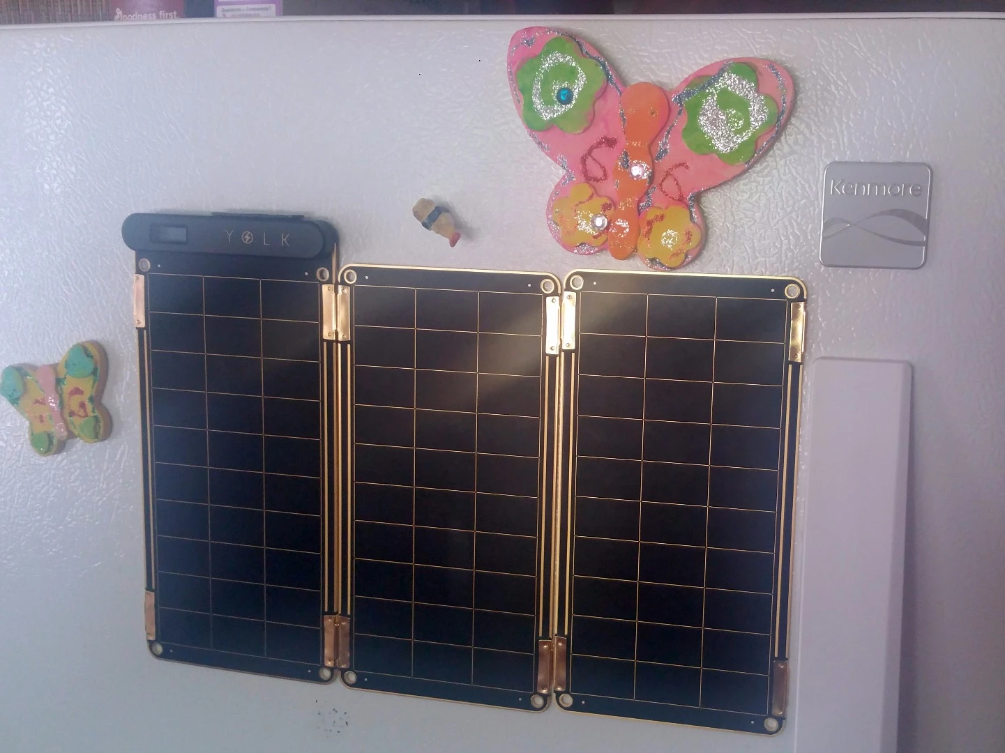 Solar Paper's magnets are just powerful enough to stick to a refrigerator and sustain grip without letting the panels slide down