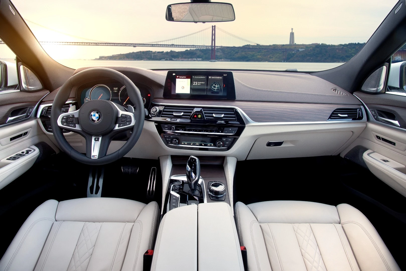 The iDrive infotainment with a 10.2-inch touchscreen is standard, as are two USB ports and a wireless charging pad