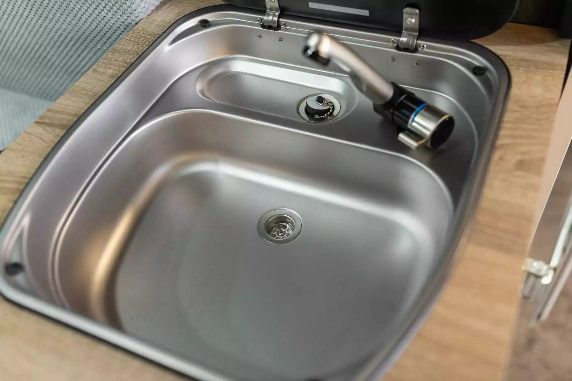 Dometic stainless steel kitchen sink with glass cover