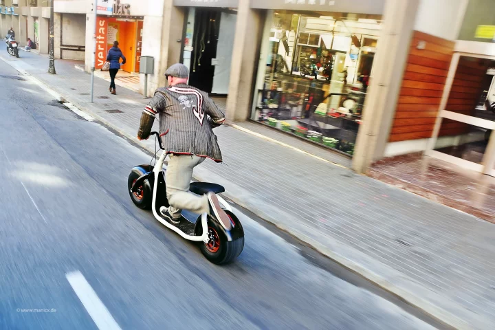 The Scrooser is an electric scooter that amplifies leg kicks delivered to the ground by its rider