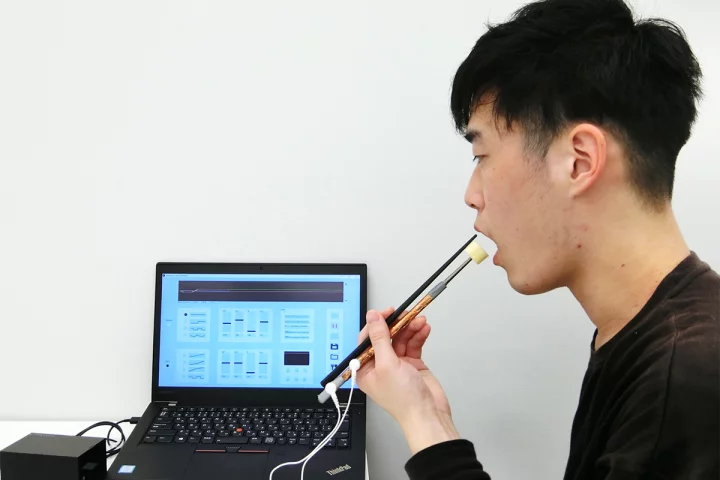 Electro-stimulation chopsticks can make reduced-salt food taste