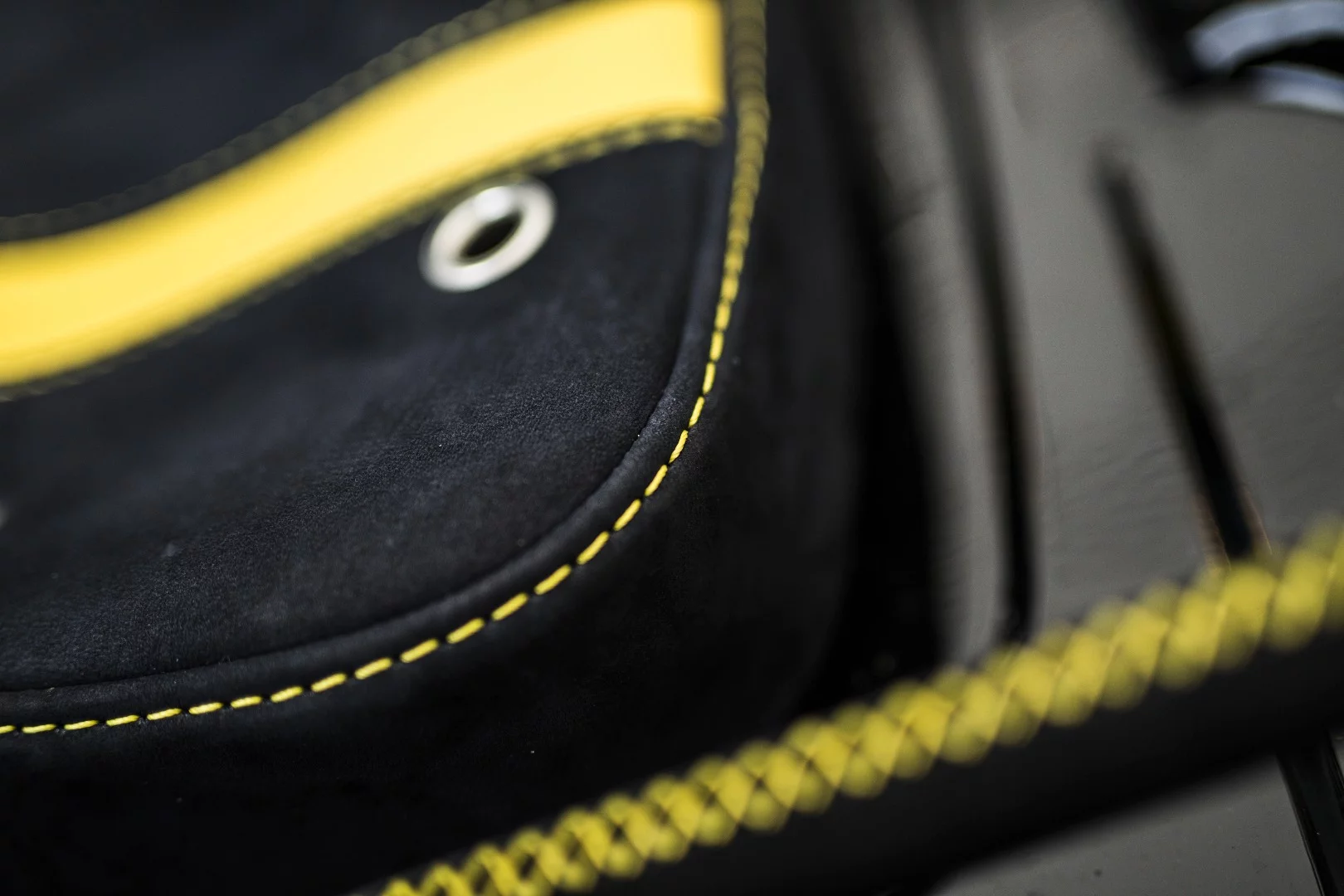 The seat looks much comfier than the stock bucket thanks to the Q by Aston Martin treatment