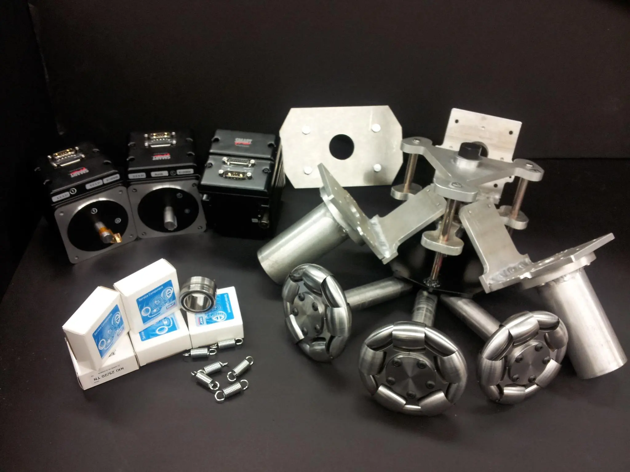 All the electric drive system components ahead of assembly, including the omniwheels made from zinc-coated 4130 steel