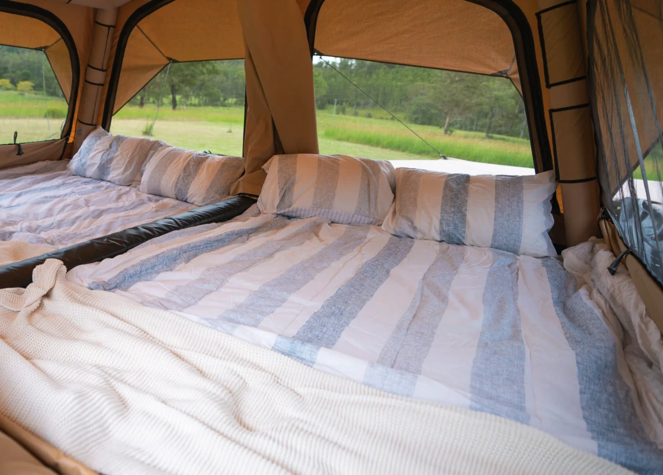Two independent queen beds, divided neatly